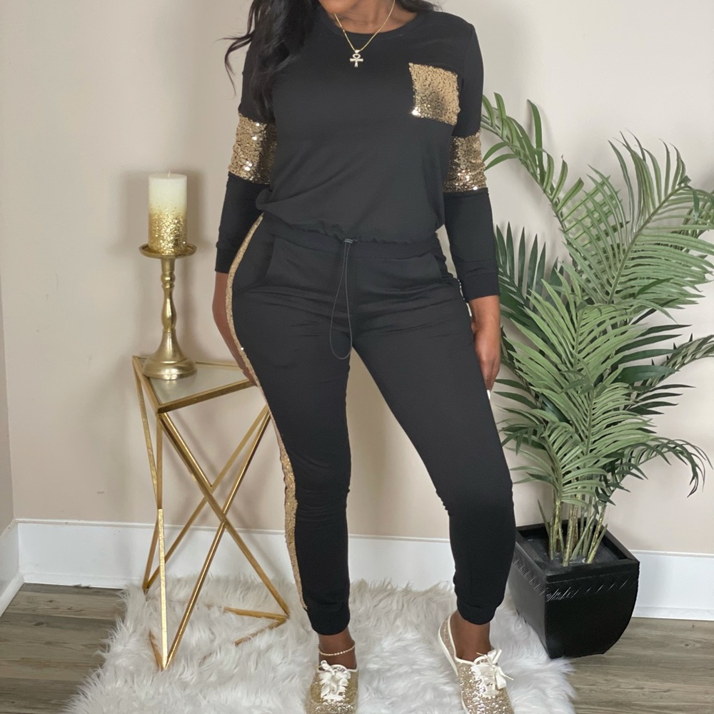 Black and gold sweat suit